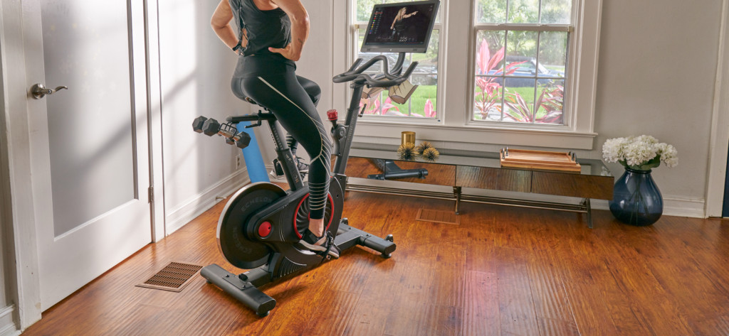 woman exercising in her house at home